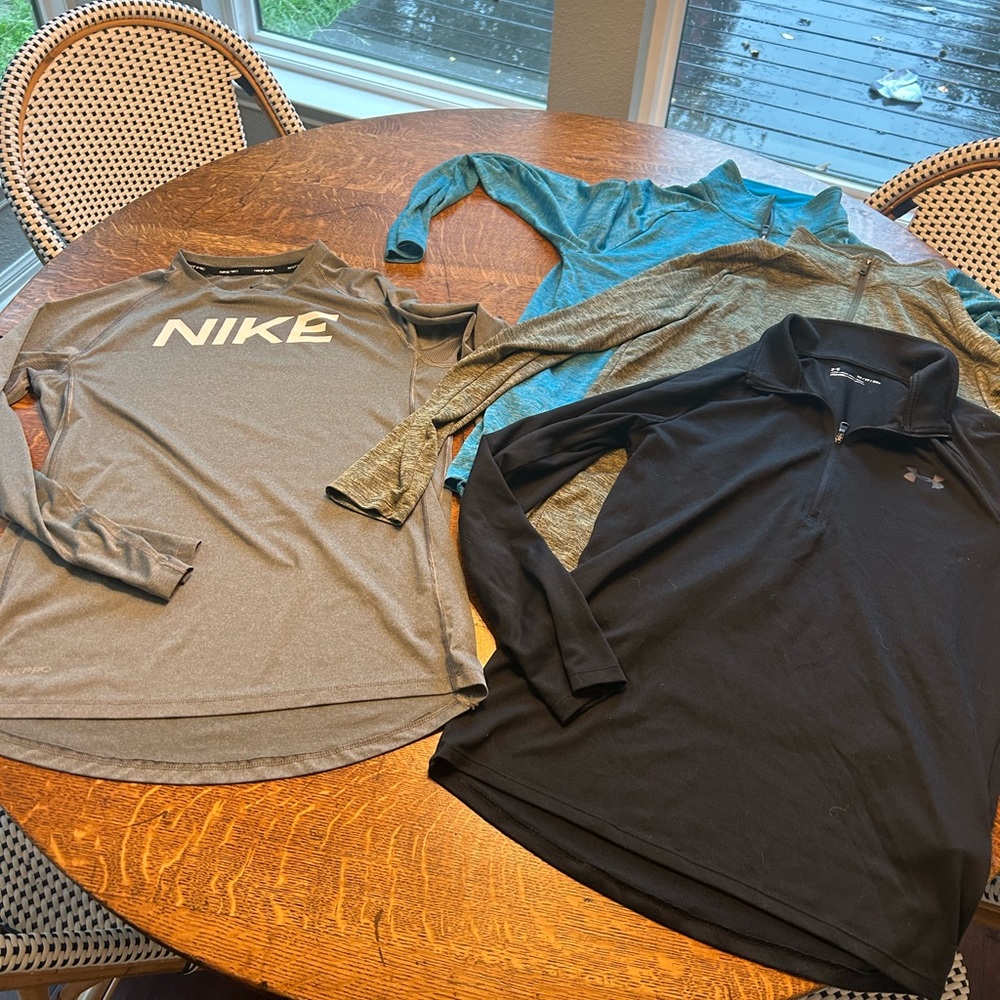 Lot of 4 gently used Under Armour half zip mens x- small or youth xl.